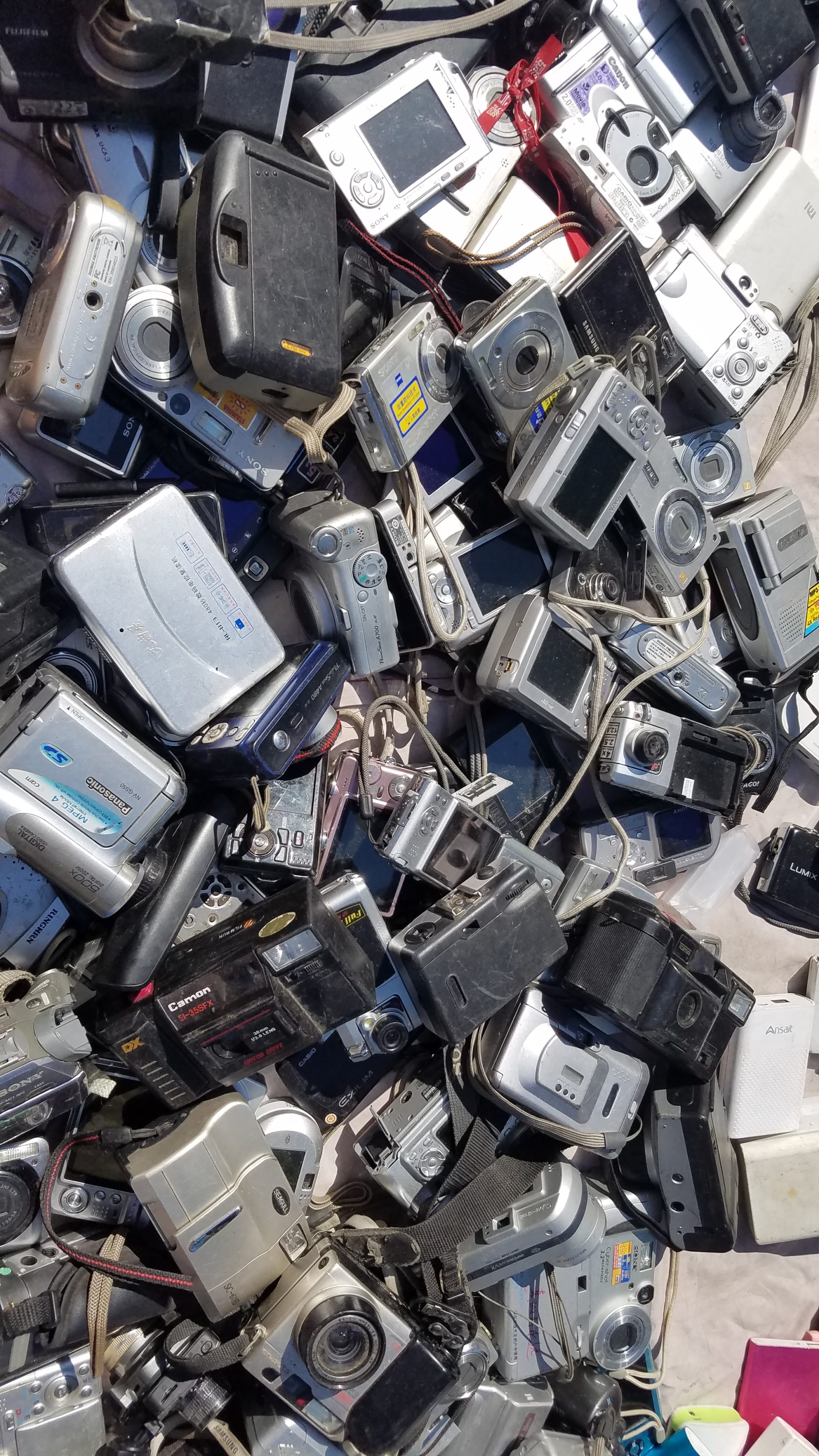 pile of used cameras